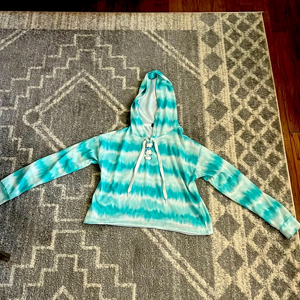 Selling a teal and white striped sweatshirt by Rock and Roll.